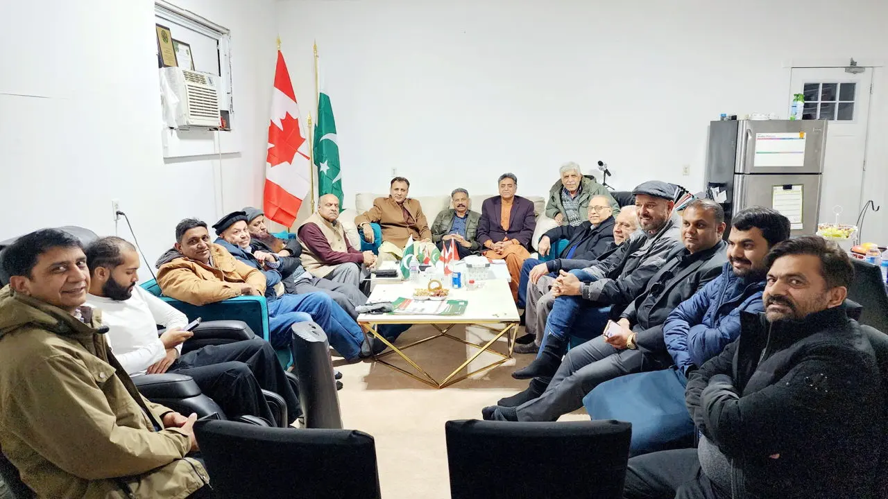 PCBO members meeting under the Canadian and Pakistani flags